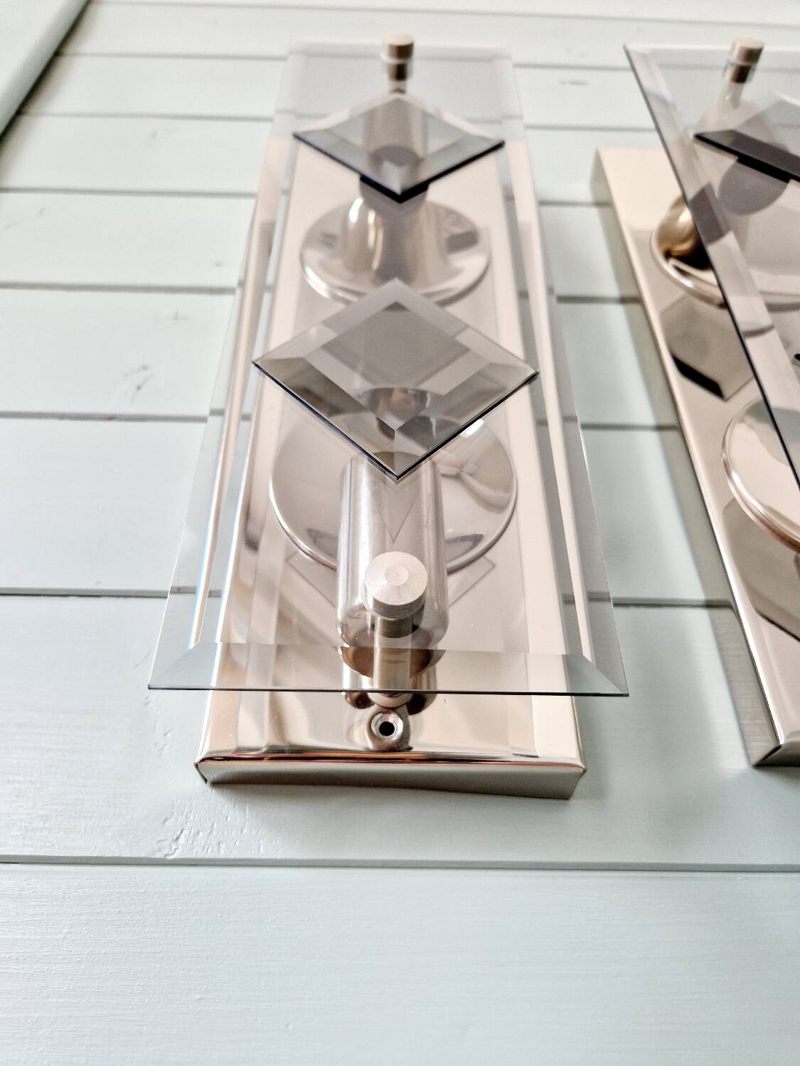 Pair of chrome metal and smoked glass wall sconces, 1970s.