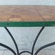 Bistro table in wrought iron and walnut