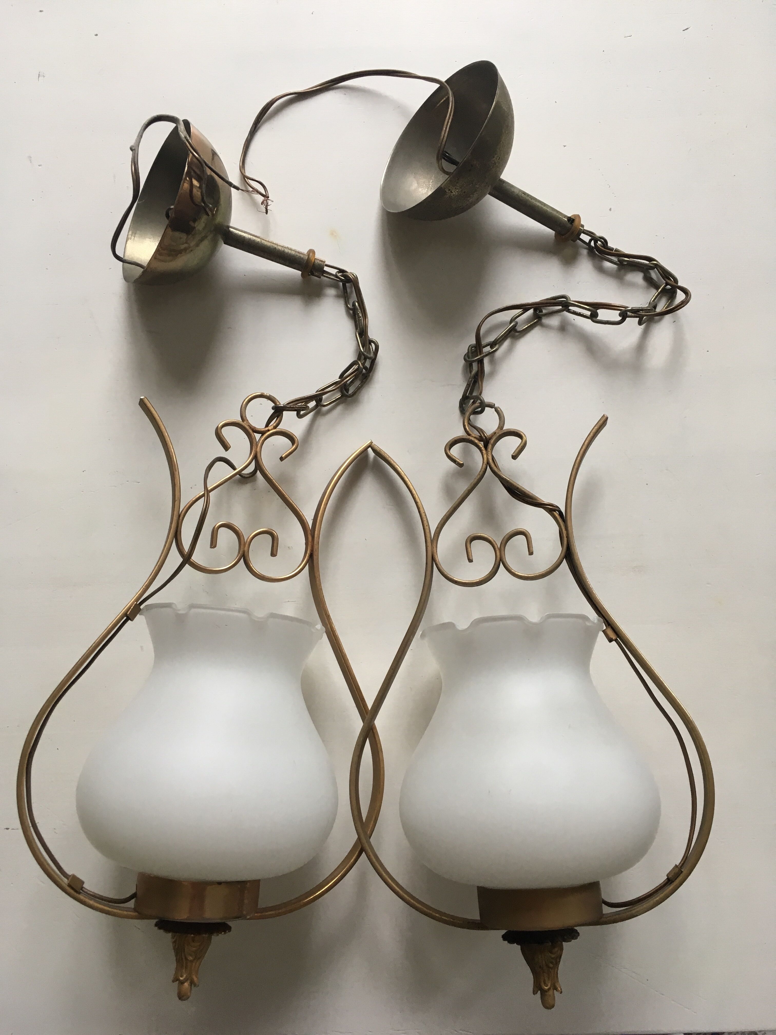 Pair of white tulip and brass pendant lamps