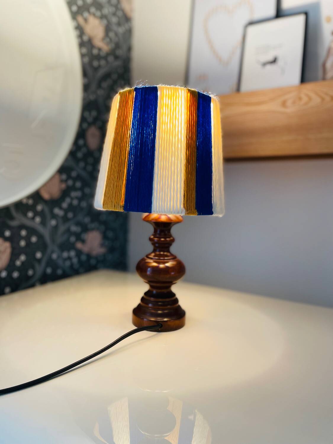 Vintage lamp with turned wooden base, striped wool lampshade