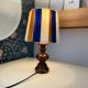 Vintage lamp with turned wooden base, striped wool lampshade