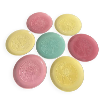 7 multicolored plates with old Nyon porcelain trades