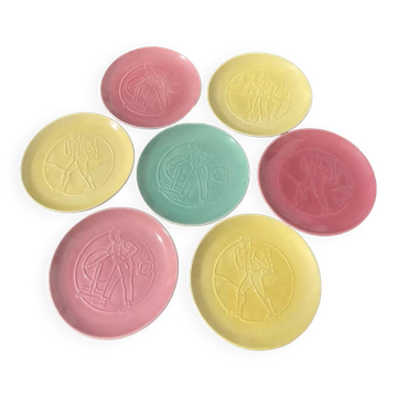 7 multicolored plates with old Nyon porcelain trades