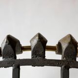 Old cast iron and brass log holder