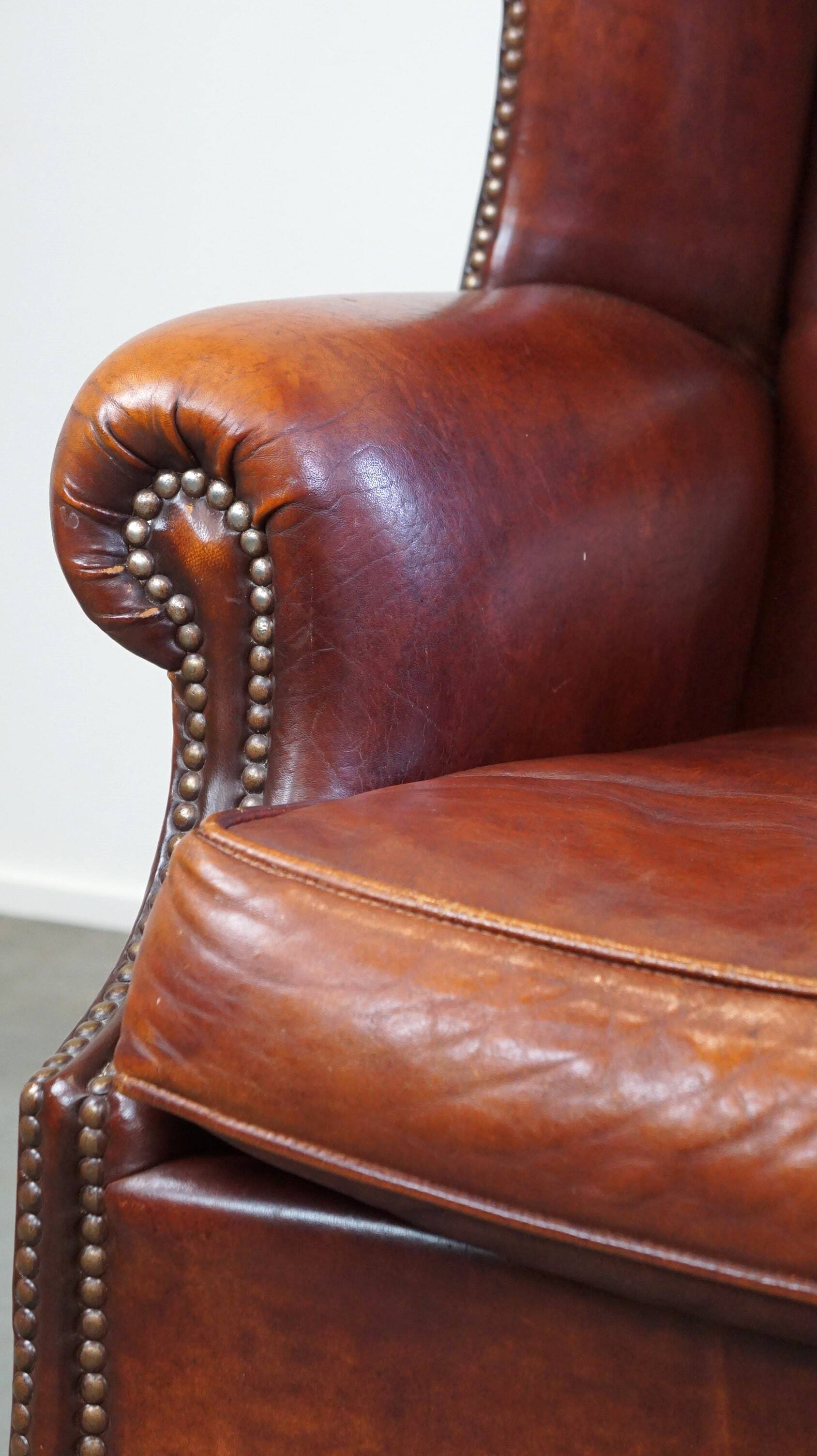 Large comfortable sheepleather wingchair in good condition and beautiful colours