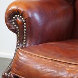 Large comfortable sheepleather wingchair in good condition and beautiful colours