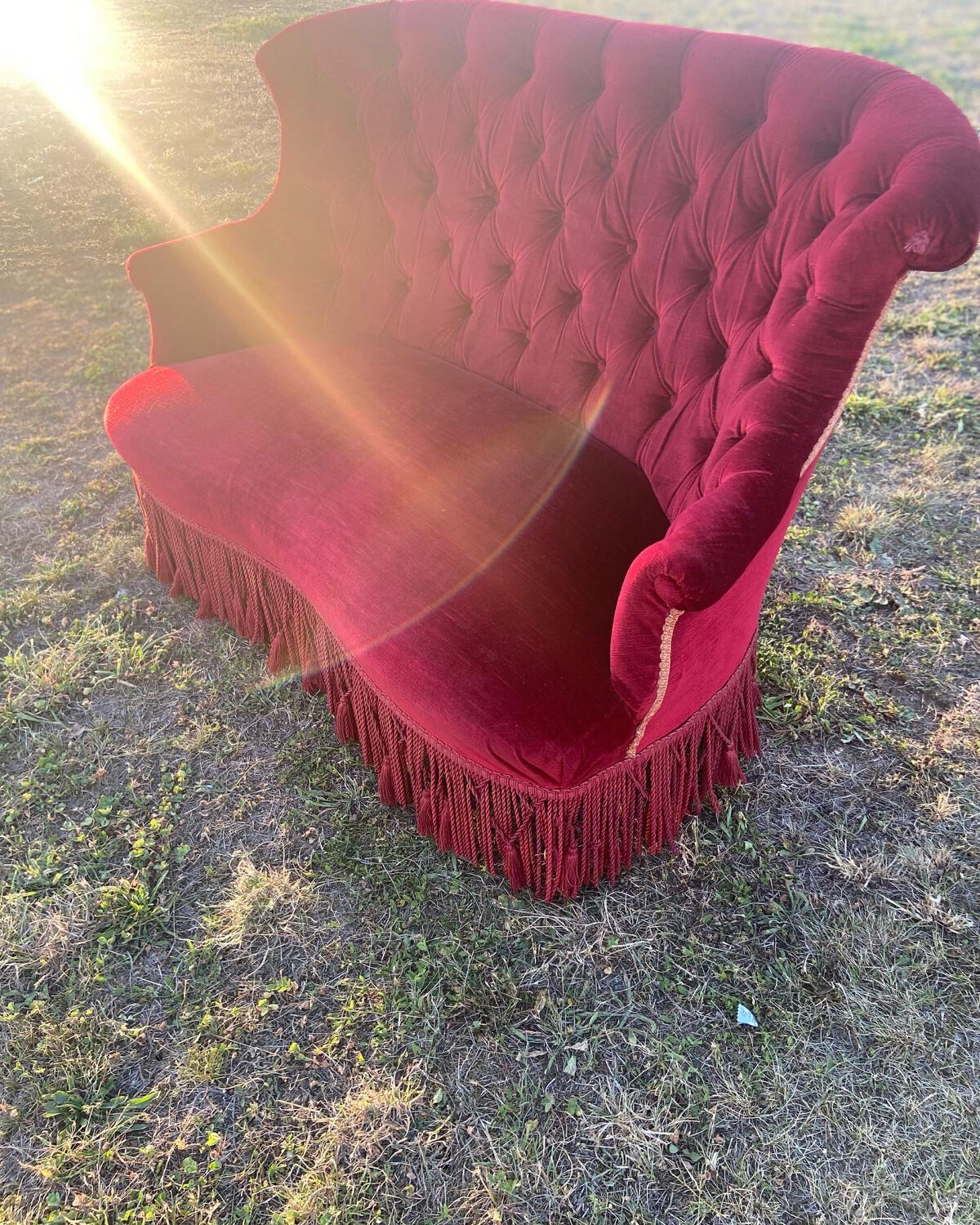Small old Napoleon III toad sofa in red velvet