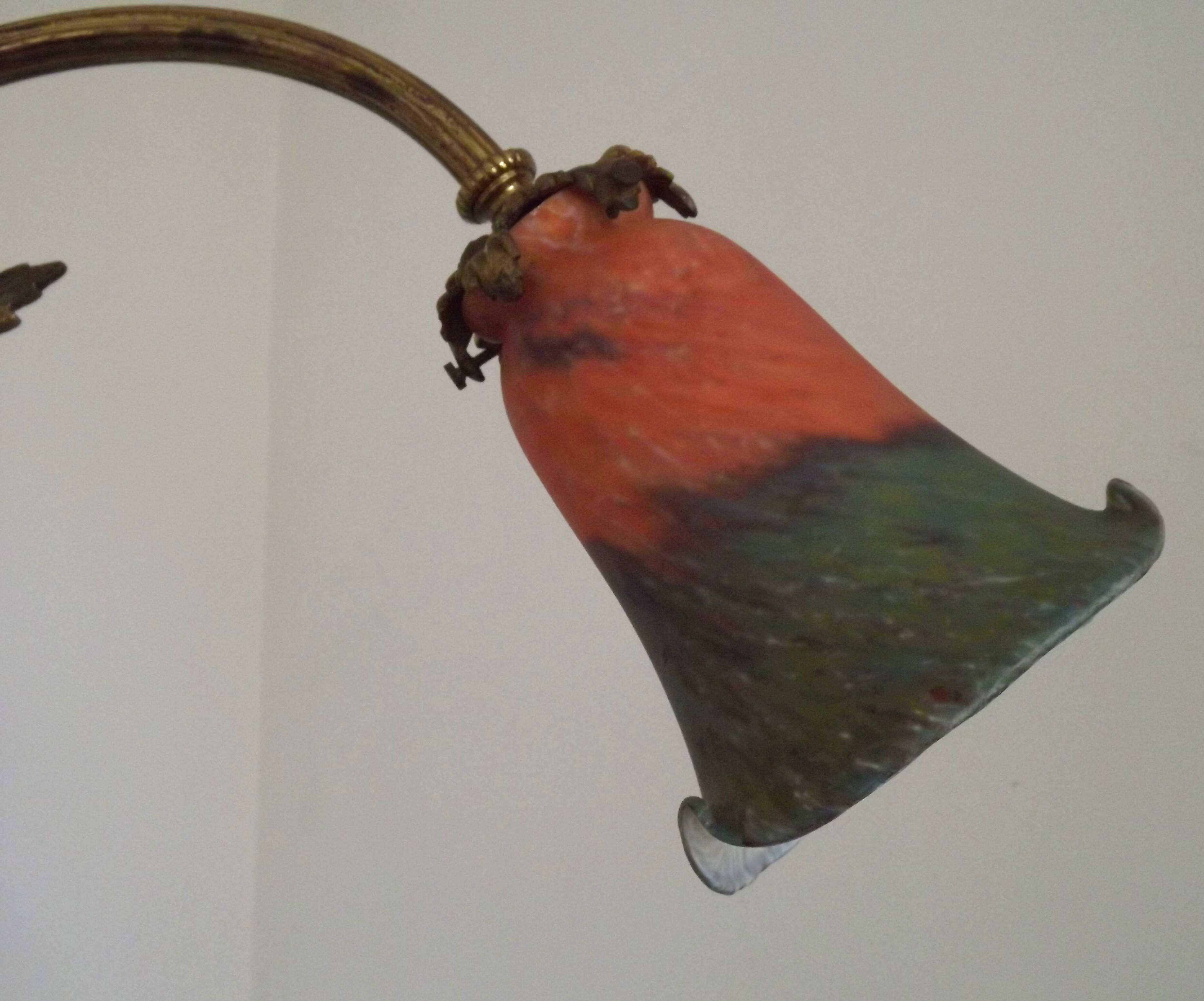 Art Nouveau three-light chandelier in bronze with orange and green glass shade, France.