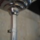 Art Deco suspension globe in white opaline with an aluminium stem.