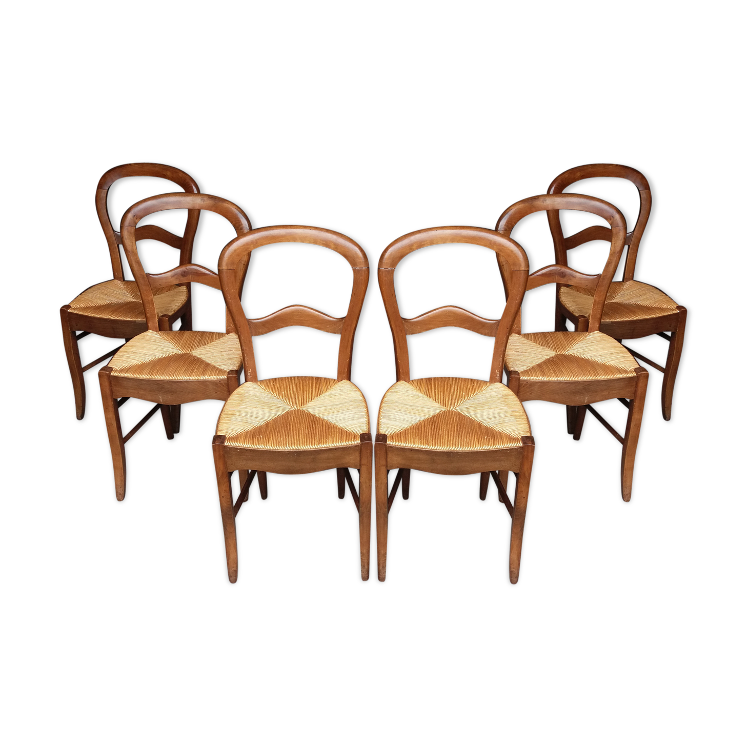 6 rustic straw chairs.