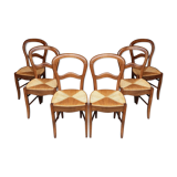 6 rustic straw chairs.