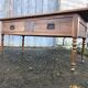 Solid cherry game table with 2 front drawers and panelled crosspieces.