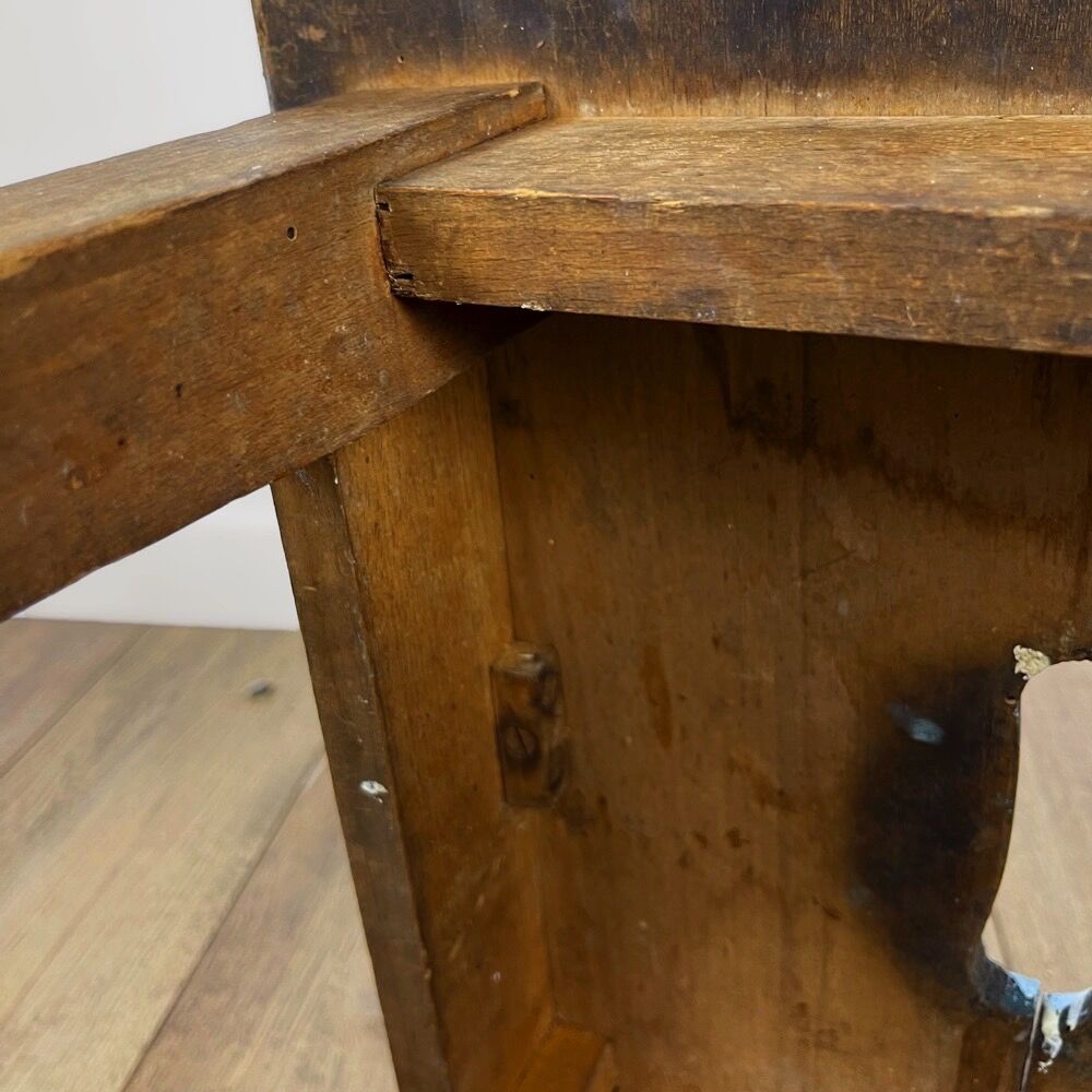 Old wooden slot stool