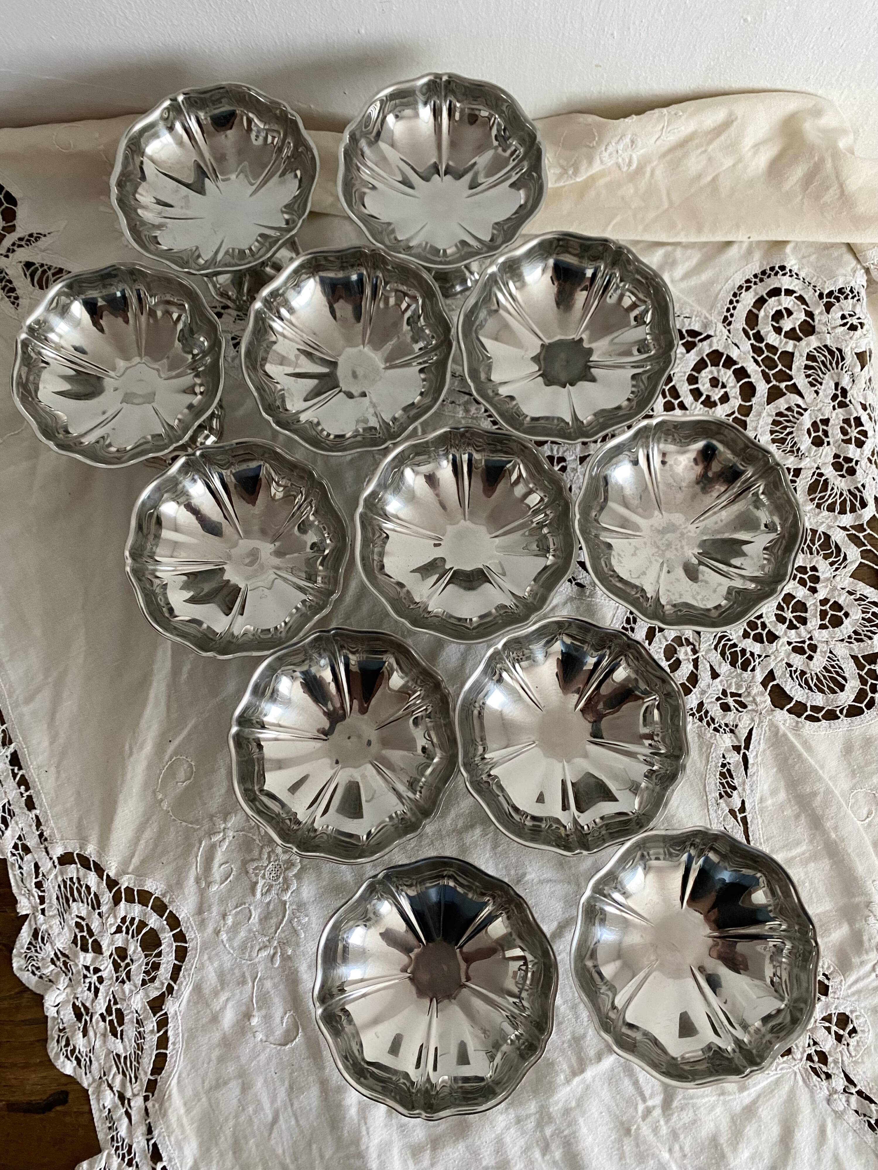 Vintage stainless steel cups on foot