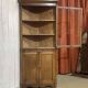 19th-century English corner cabinet in oak, mahogany, and fir.