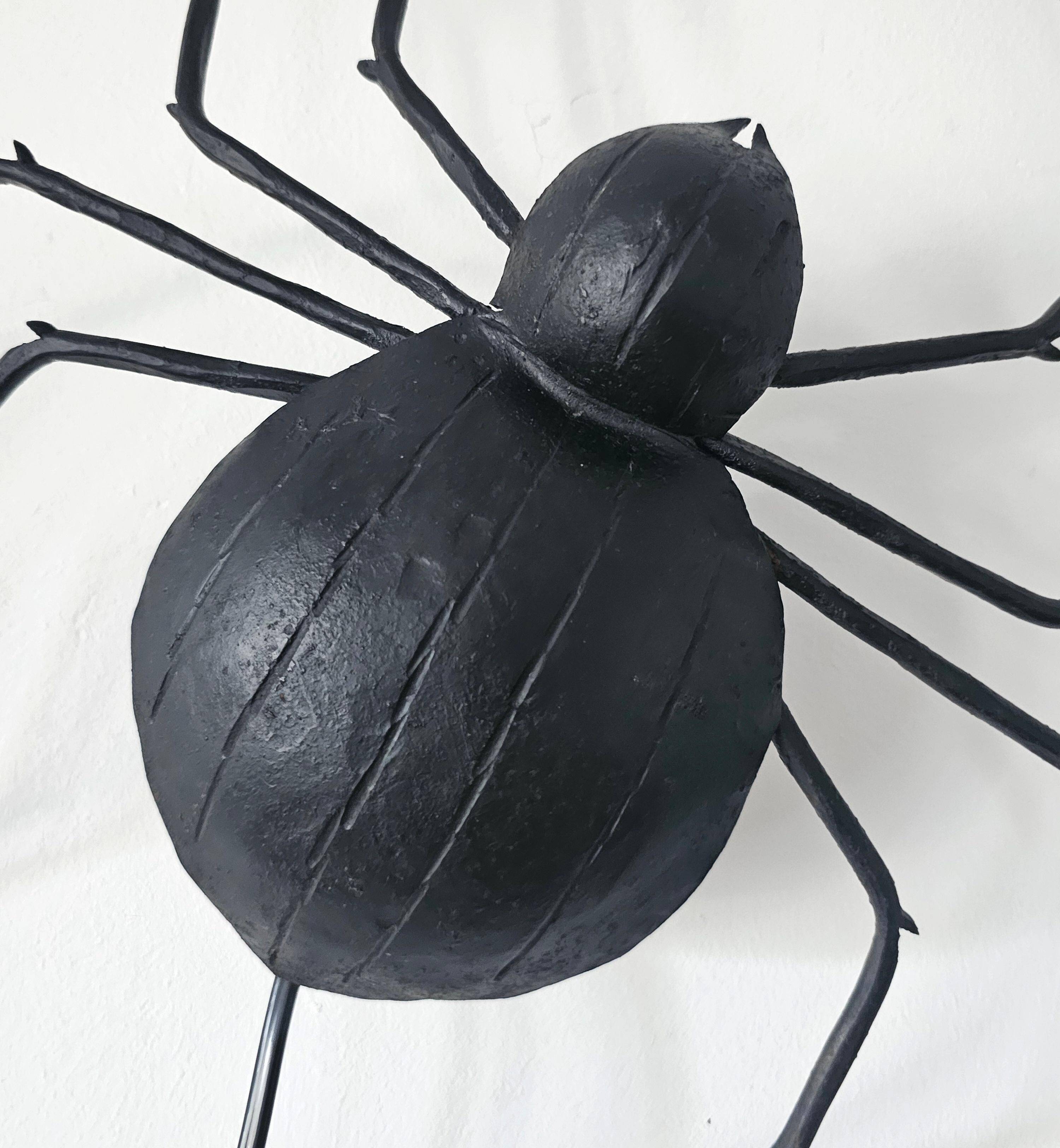Wall lamp in iron Mid Century Modern spider style from the 1960s.