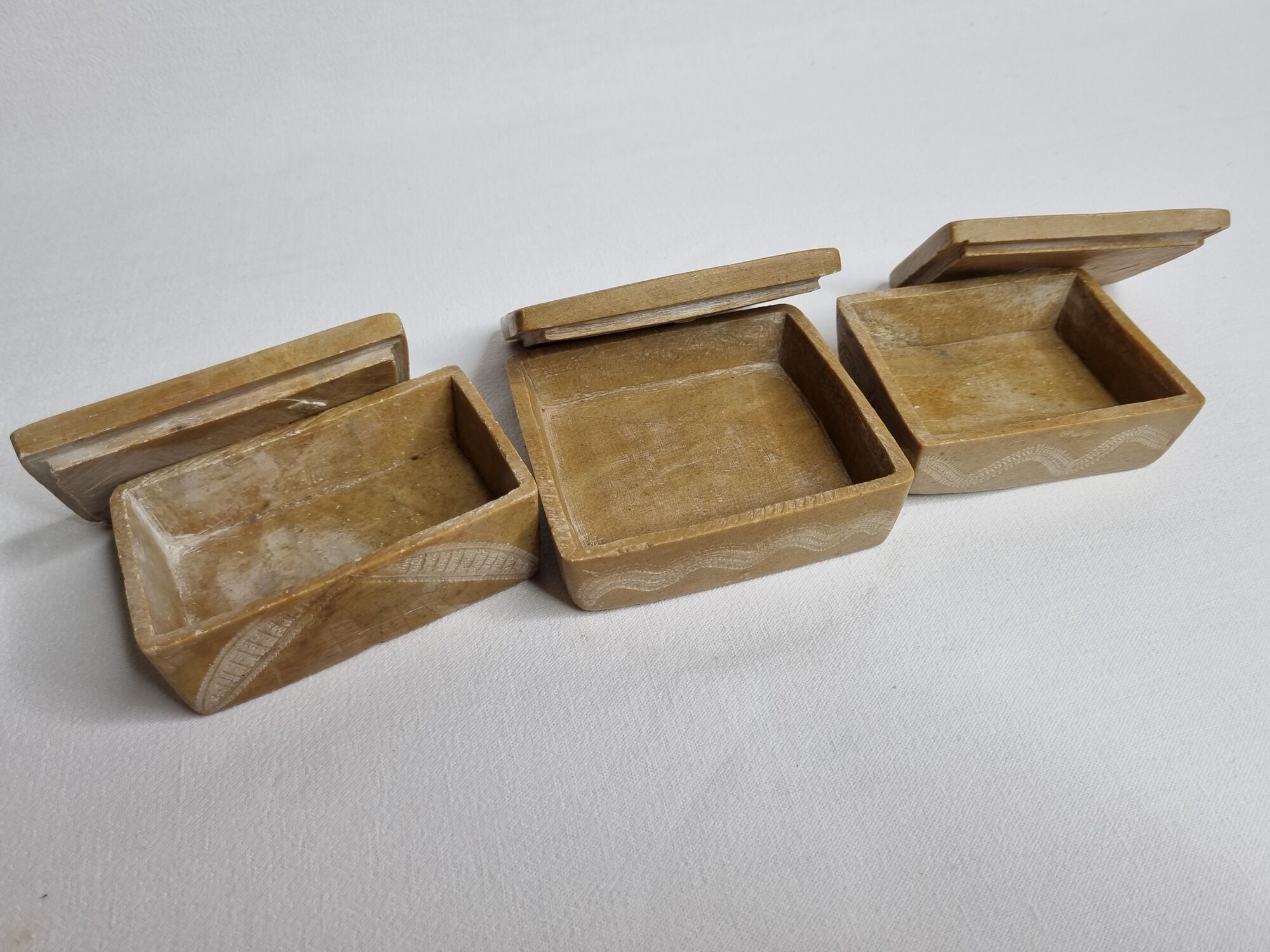 Set of three soft stone jewellery boxes decorated with traditional Tuareg motifs