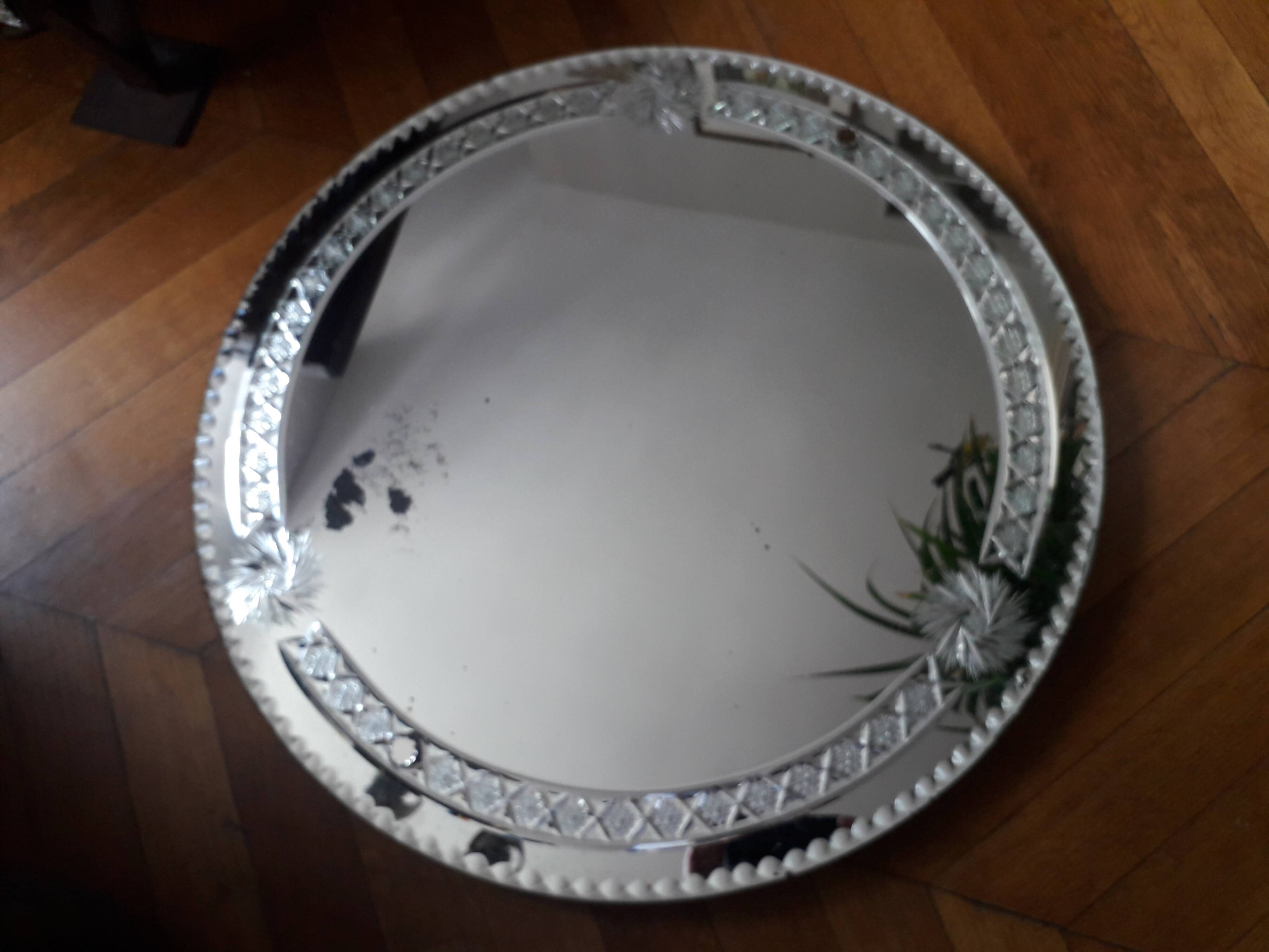 Large old round mirror finely decorated