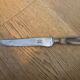 Knife with a forged steel bone handle