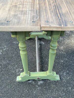 Old table with patinated green legs