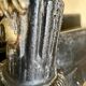 Pair of antique fire dogs with lion heads - patinated cast iron