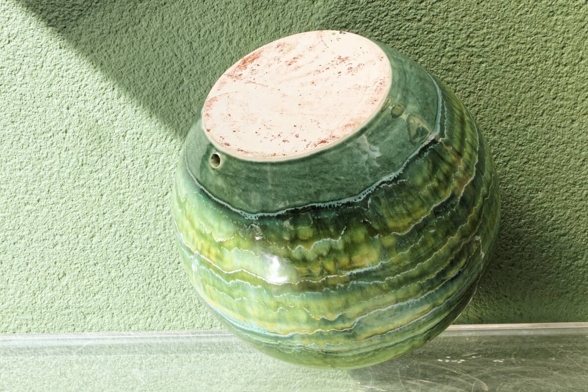 Glazed ceramic ball lamp base, green gradients.