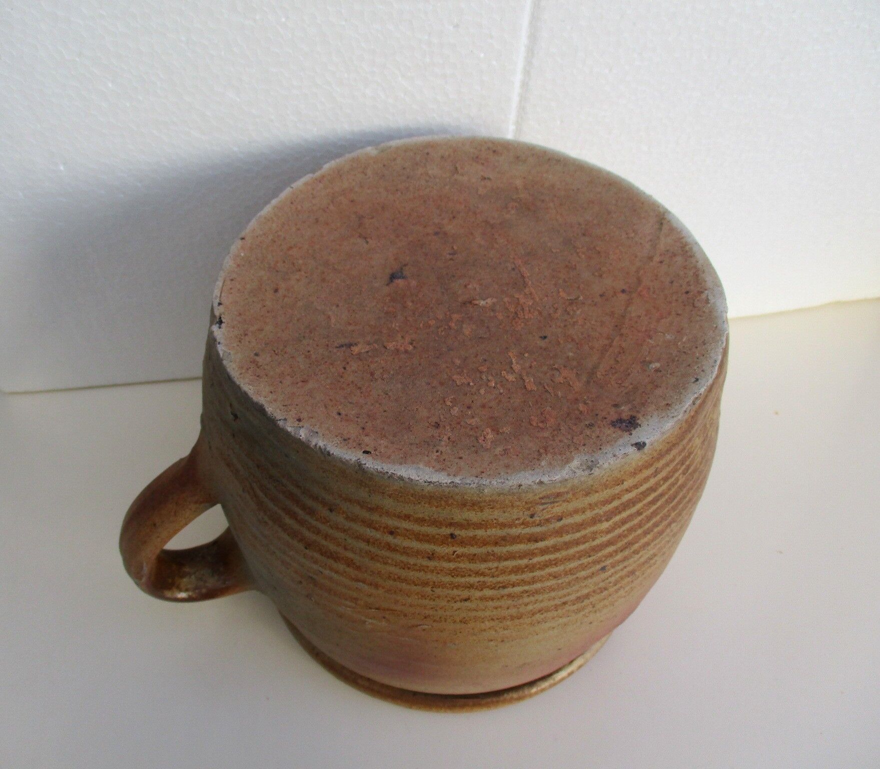 Ancient sandstone pot at one handle