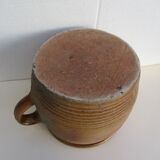 Ancient sandstone pot at one handle