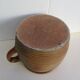 Ancient sandstone pot at one handle