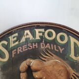 Former Seafood restaurant sign in rare relief
