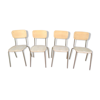4 vintage chairs with tubular metal footing, seated in wood-shaped bakelite