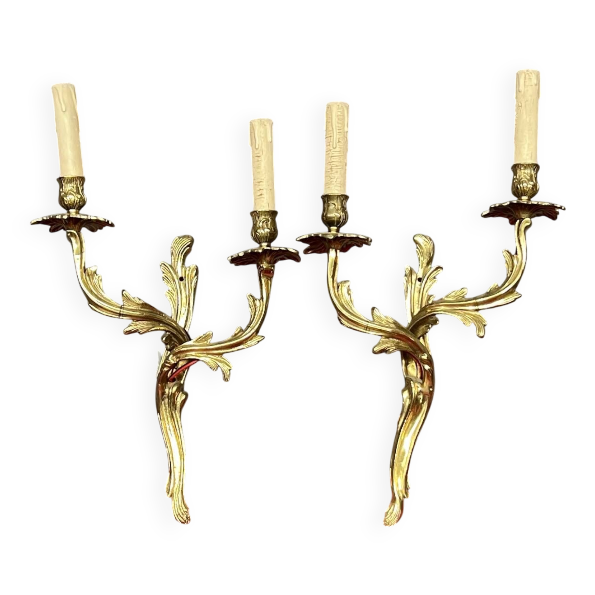 Pair of solid gilded bronze wall lights.