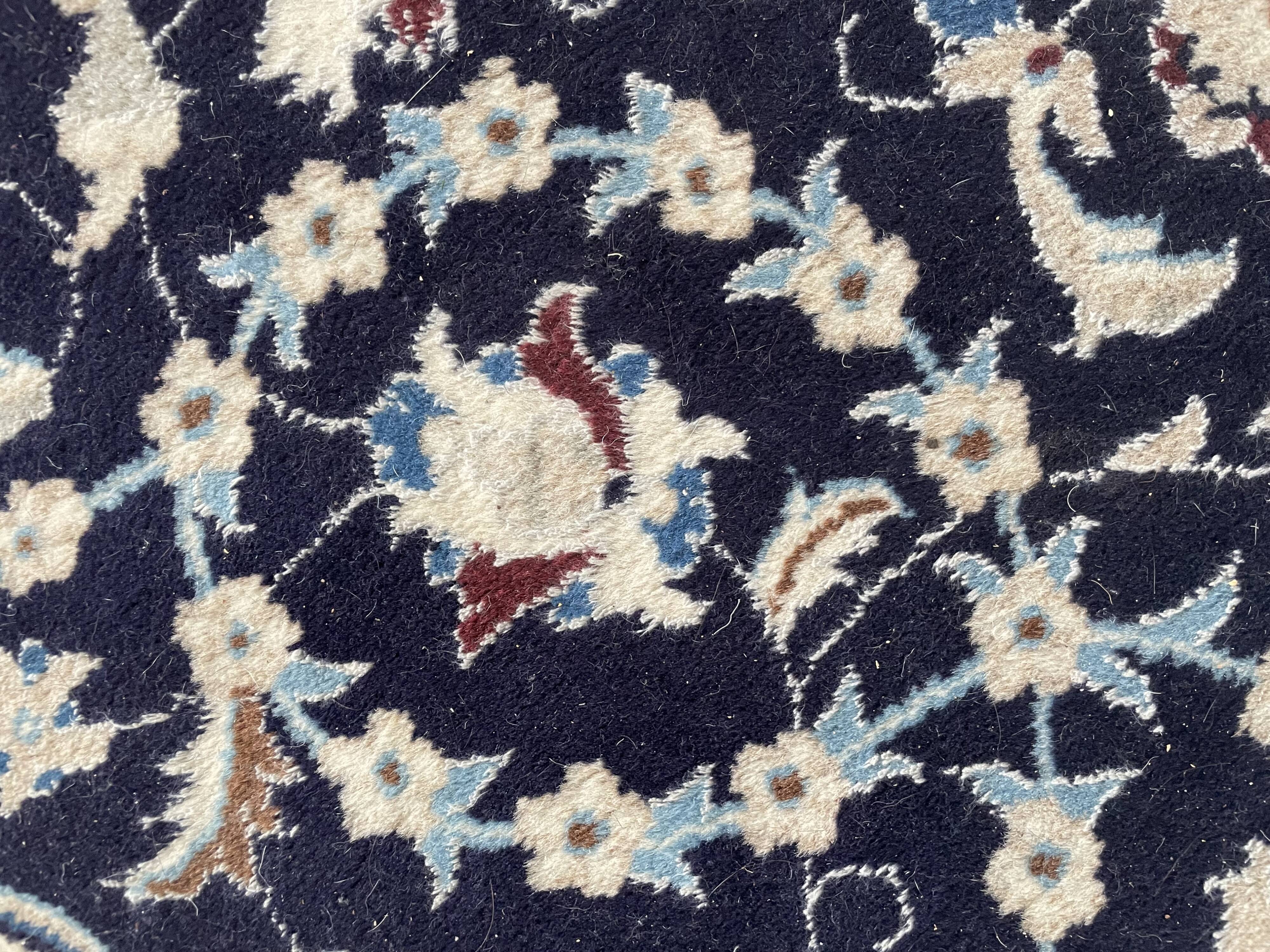Hand-knotted Nain Persian rug with blue and white floral design