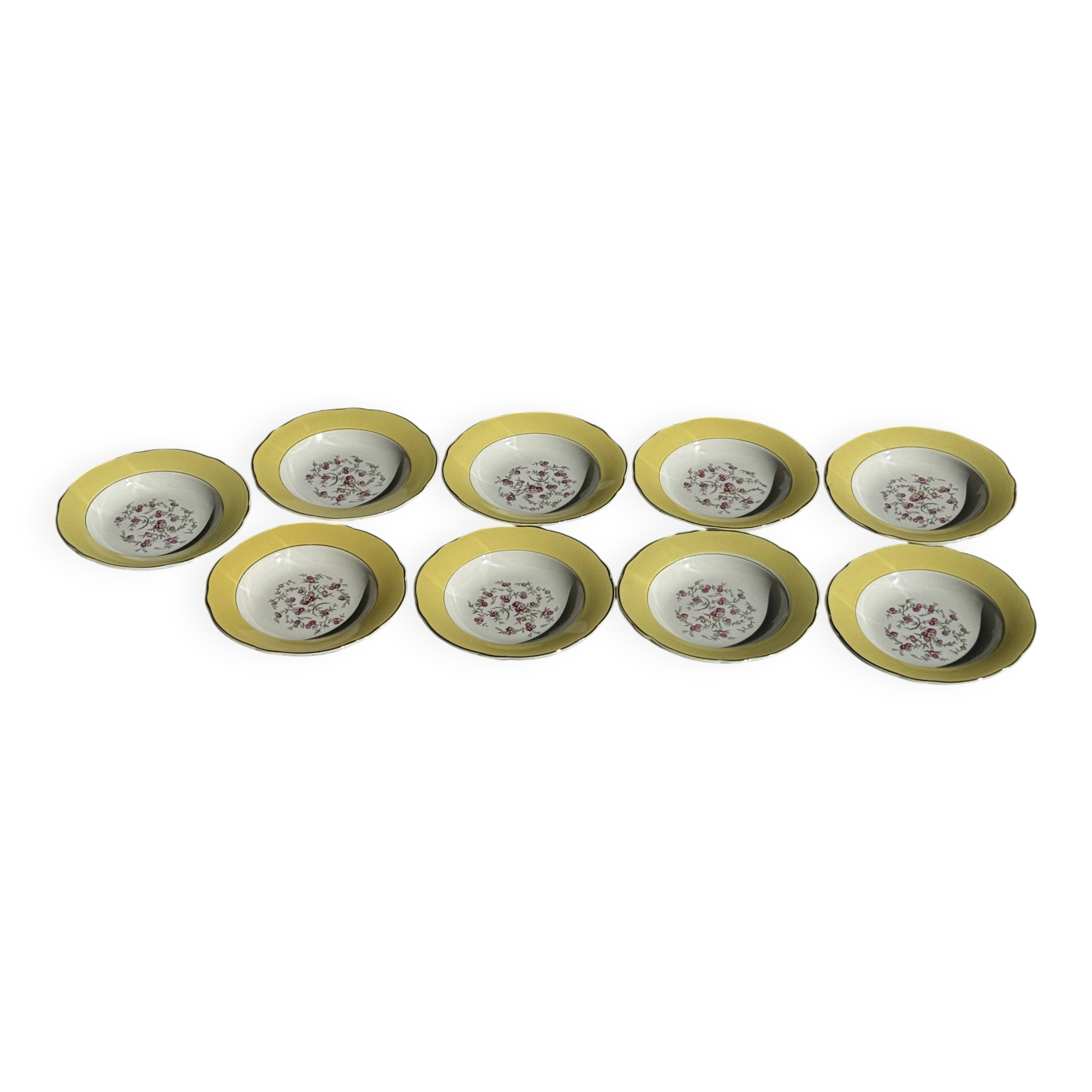 Set of 9 large vintage yellow deep plates with pink flowers and a gold rim.