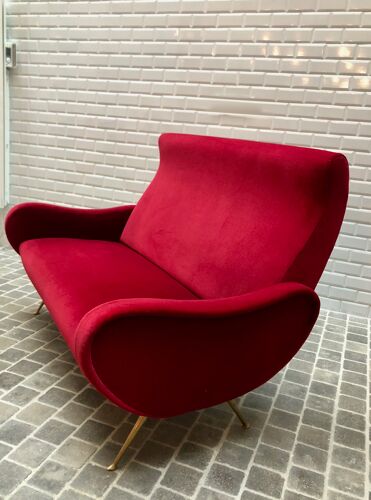 Italian red velvet armchair with brass legs