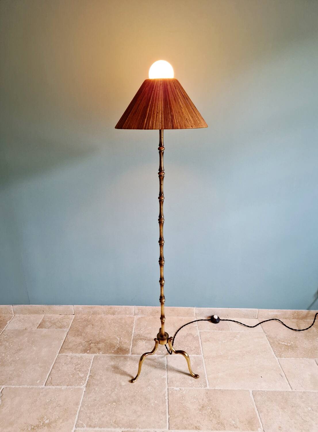 Brass floor lamp with rattan shade, 1950s-60s.