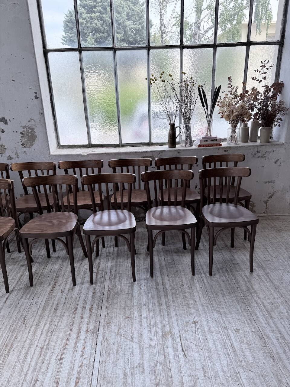 Set of 14 walnut bistro chairs.