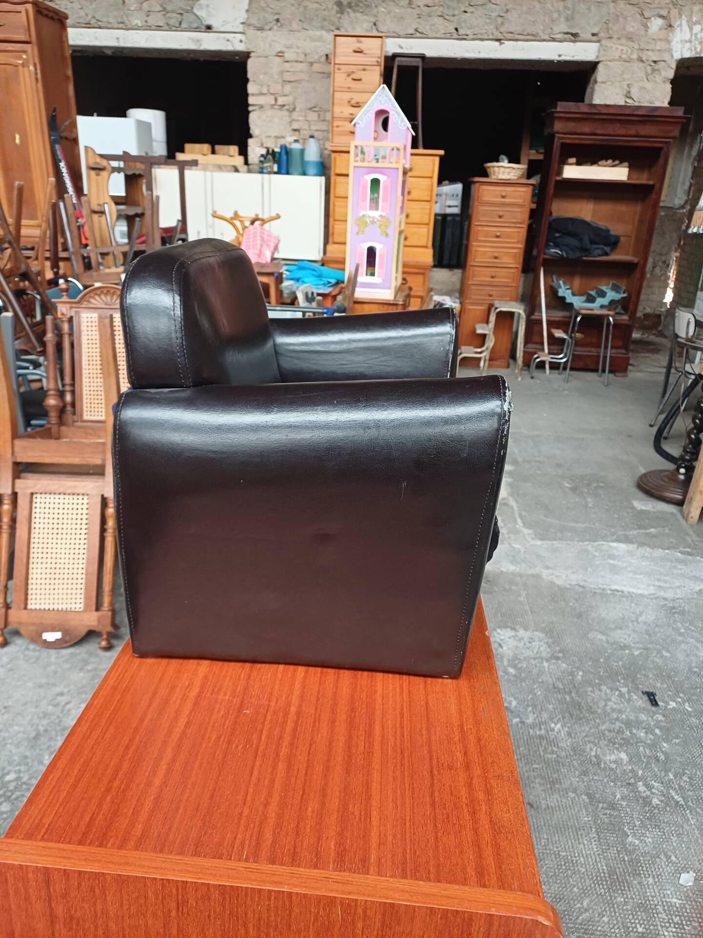 Mini black leather armchair for children