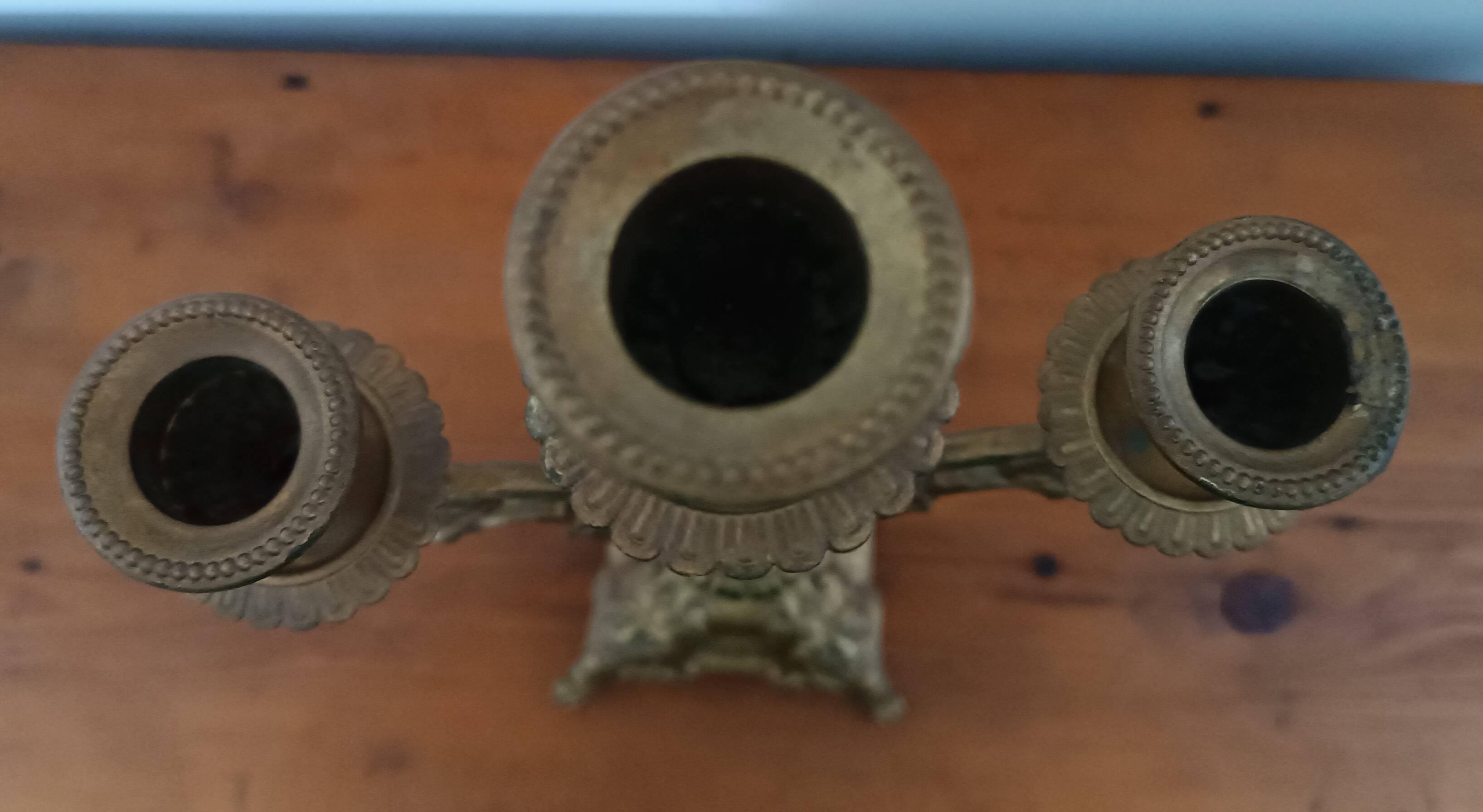 Bronze candlestick with lion head decoration