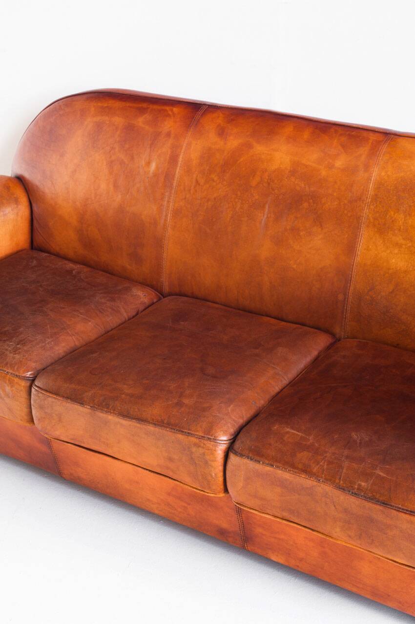 Vintage leather club sofa. Art Deco style. France, 1950s. (sofa convertible into bed)