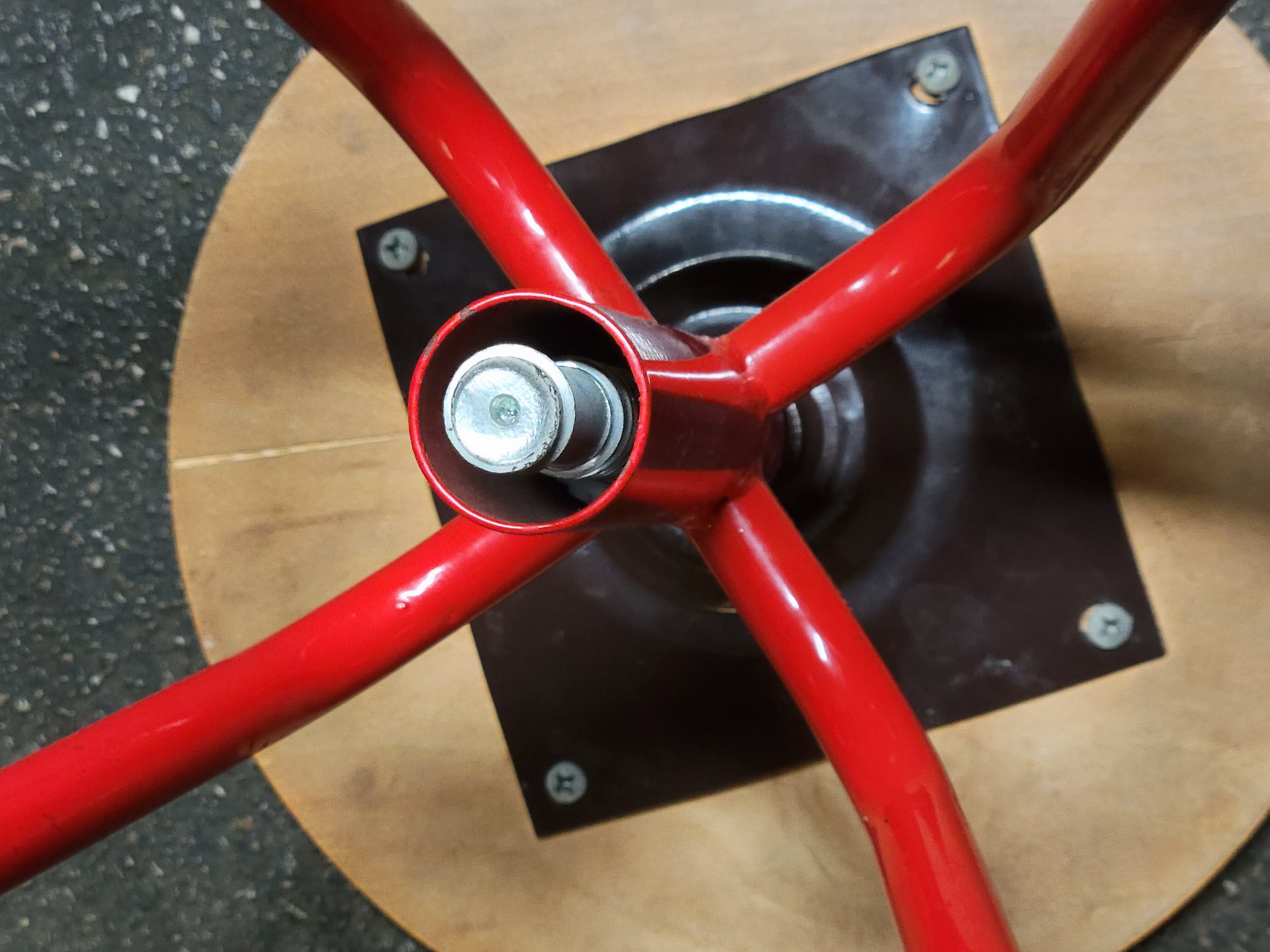 Red stool with industrial vintage screw 80s