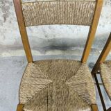 Pair of vintage wood and straw chairs