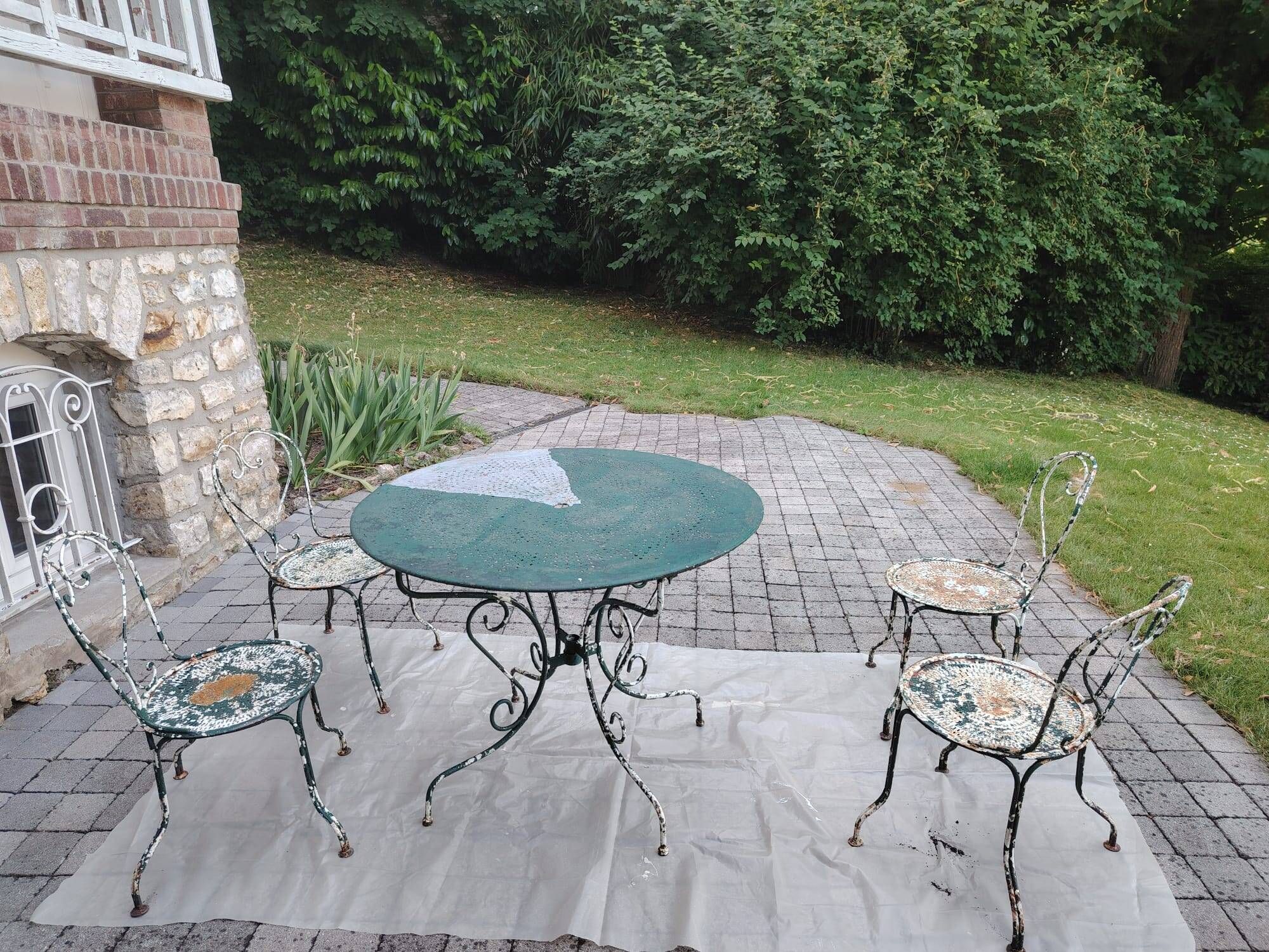 Renovated antique garden furniture in wrought iron, early 20th century.