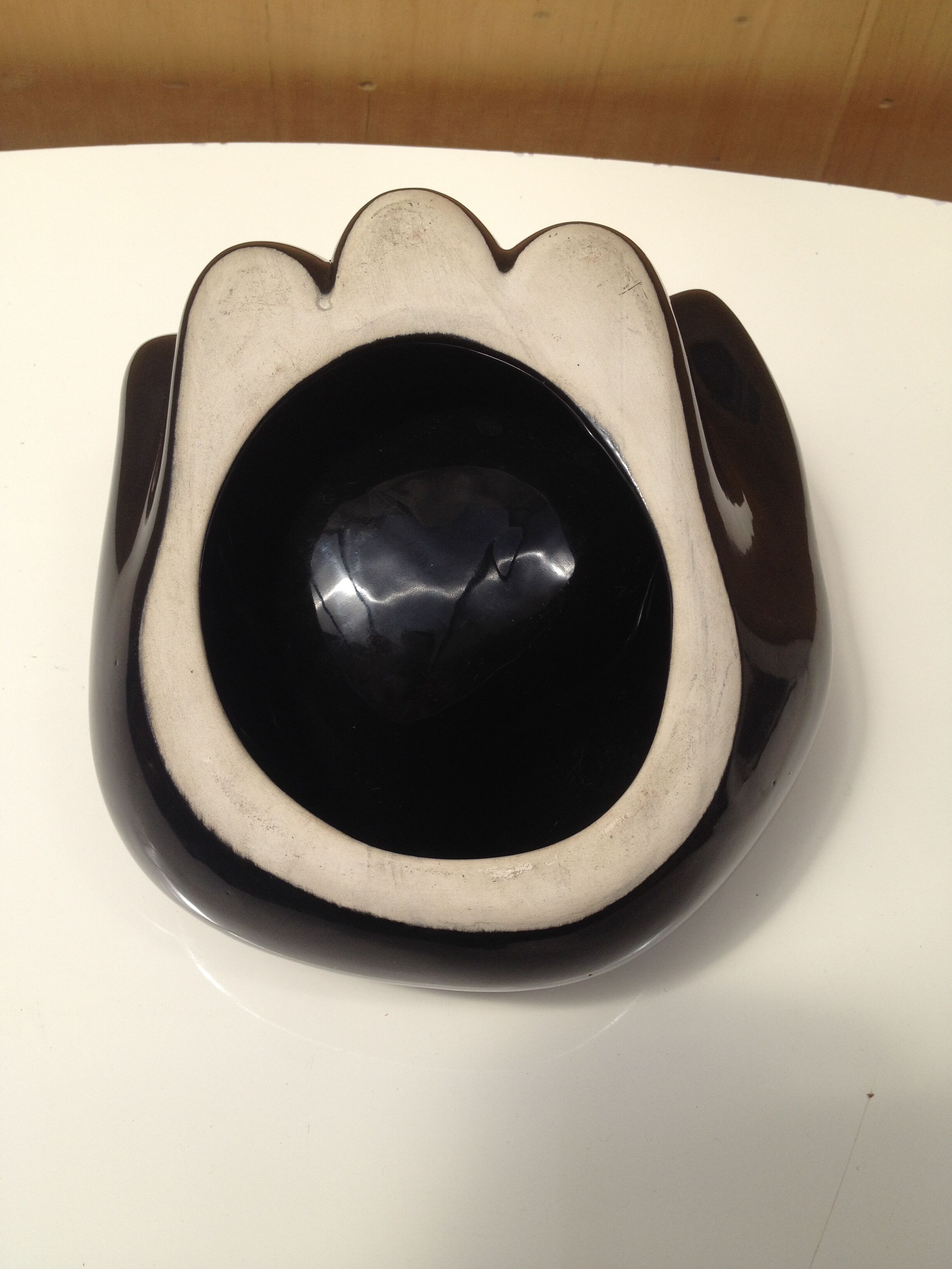 Empty ceramic hand shape pocket