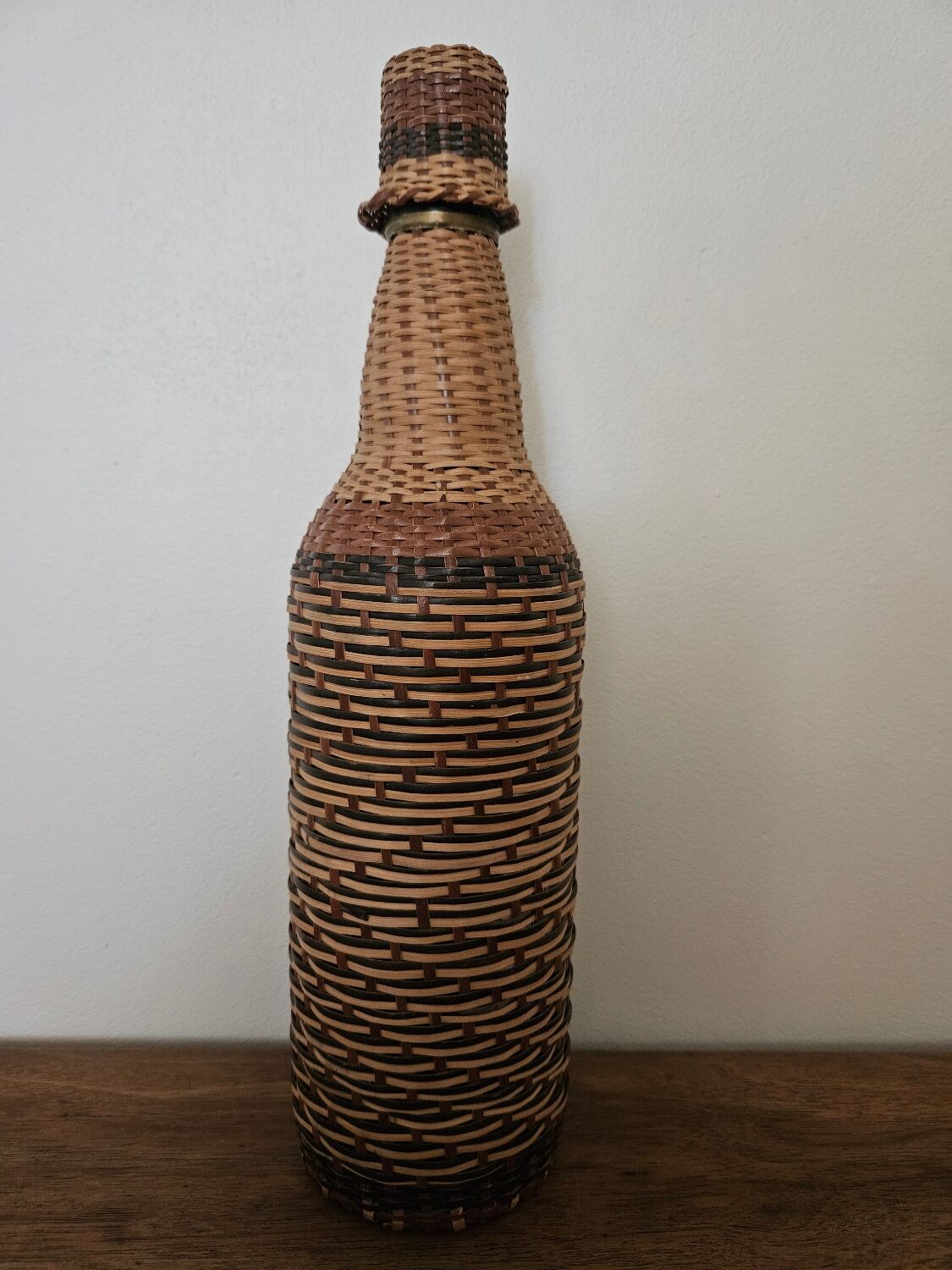 Glass and rattan bottle