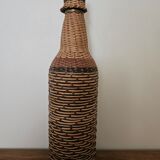 Glass and rattan bottle
