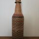 Glass and rattan bottle