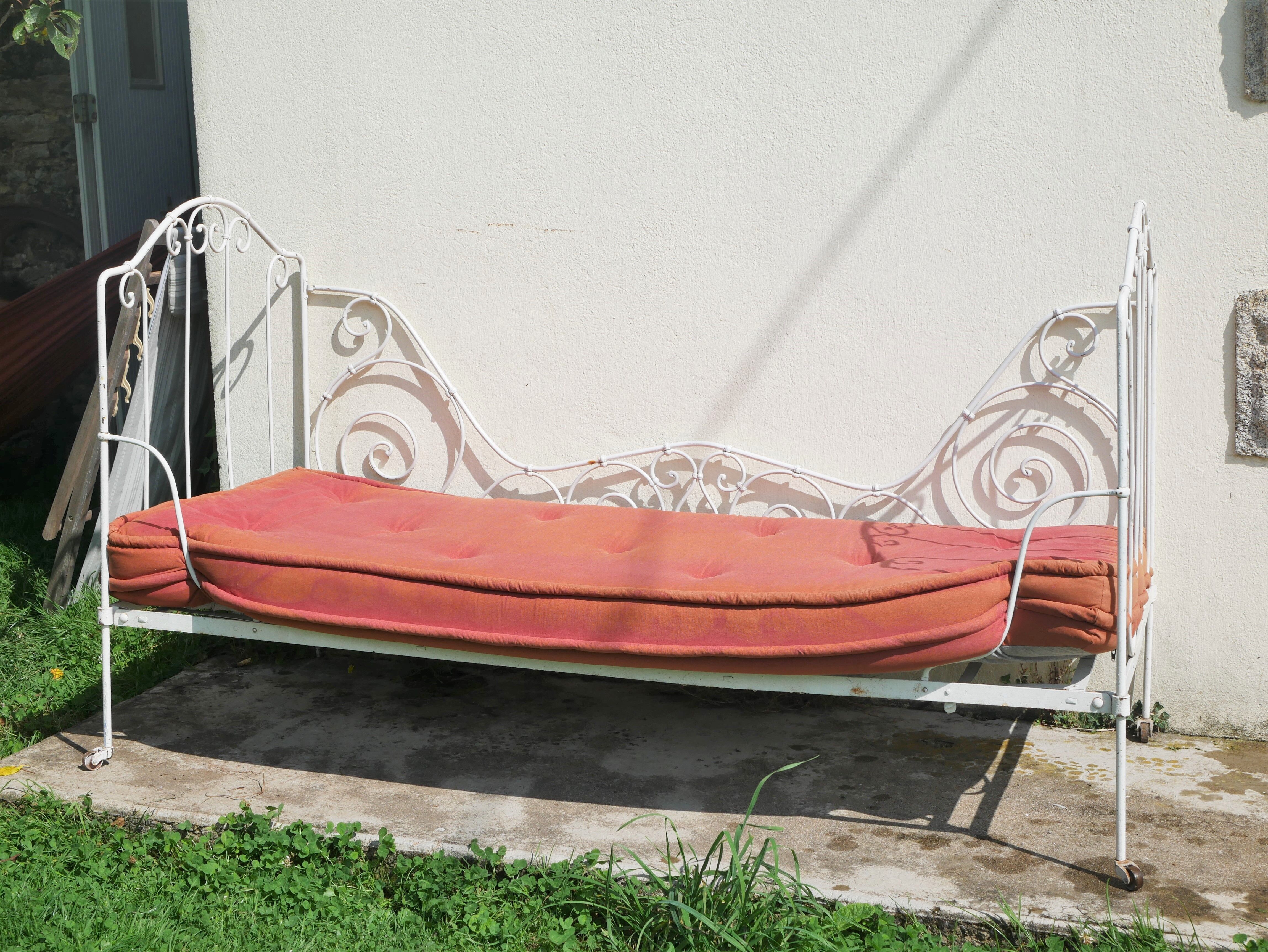 Old wrought iron bed bench