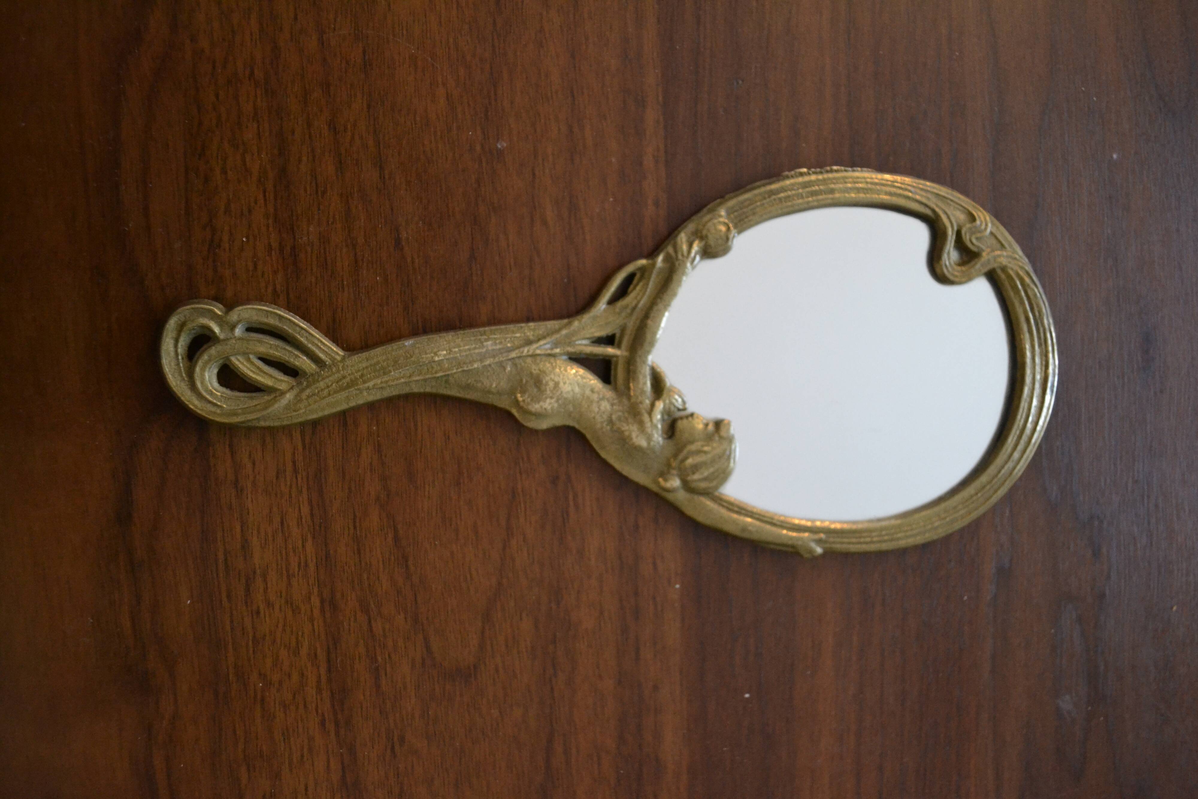 Brass hand "nymph" mirror