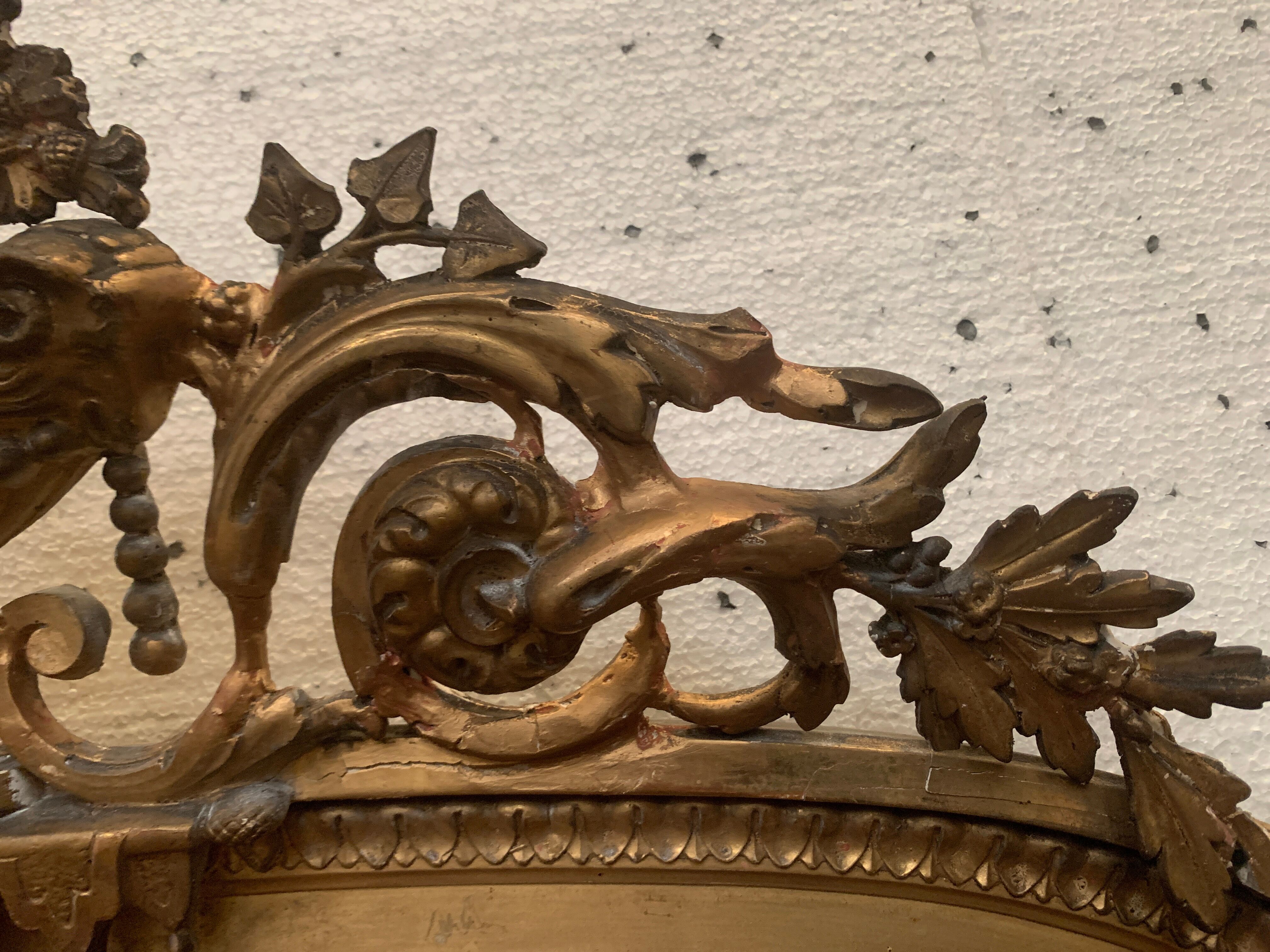 Louis XVI style mirror in wood and gilded stucco XIX century